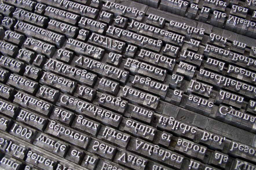 Close up of printer's type showing letters that are recognisable but also upside-down and back to front